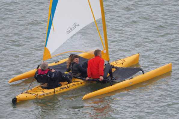 07 June 2020 - 14-00-53 
This rather interesting craft has tandem pedals driving Hobie's mirage drives. Four paddle fins underneath power things when there is not enough wind.
---------------------------
Hobie Mirage Tandem Island trimaran kayak